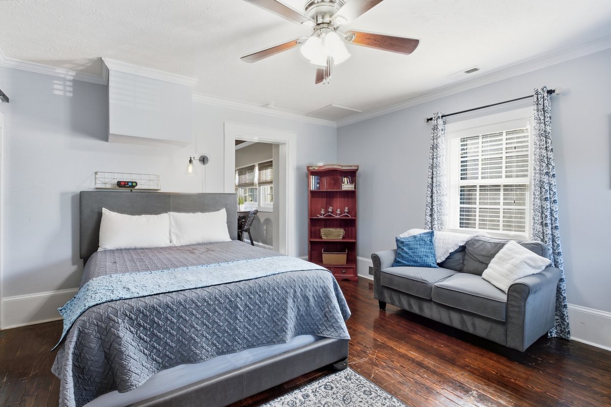 Bedroom with loveseat sitting area
