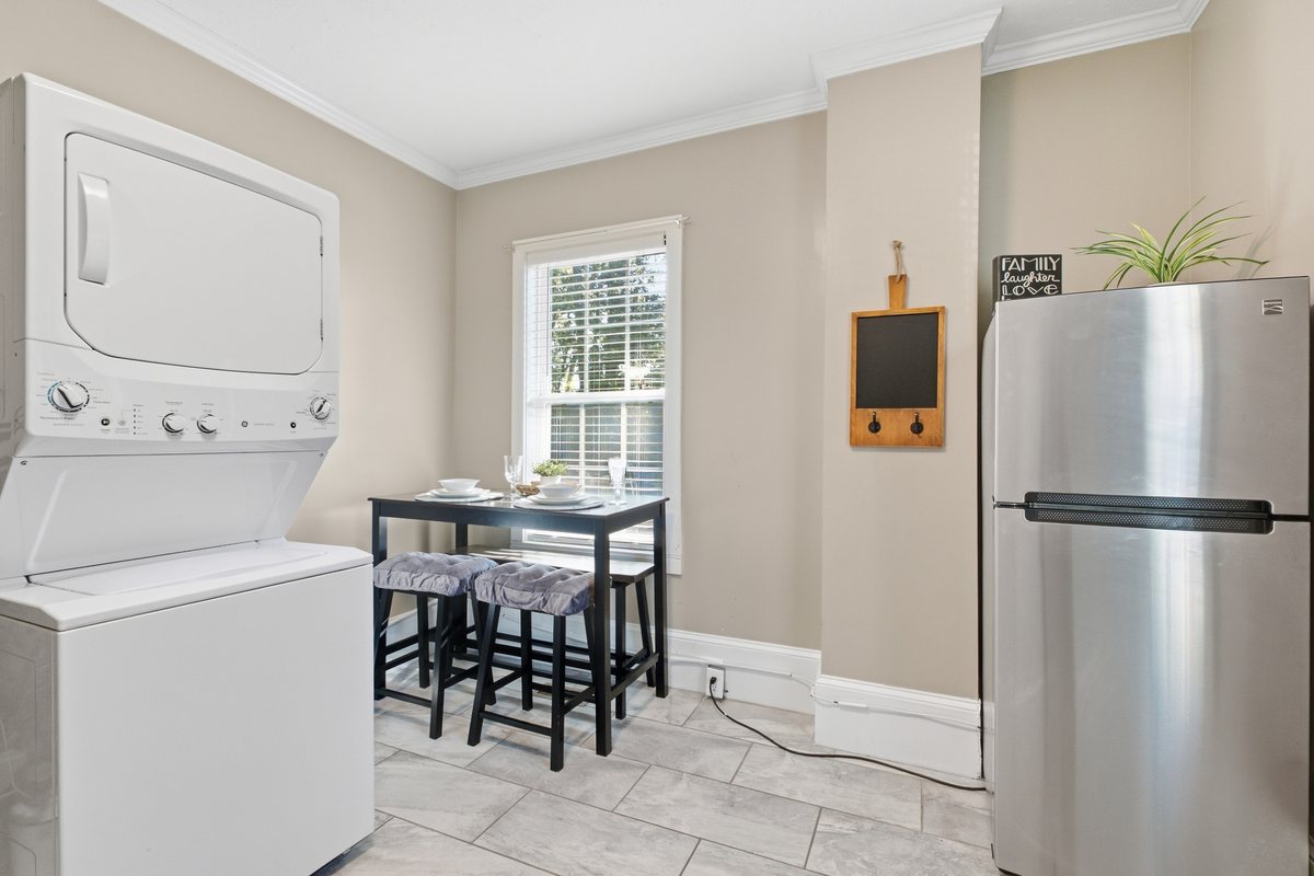 Kitchen, dining space and in-unit laundry