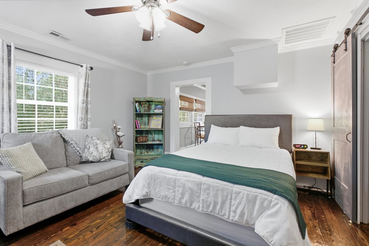 Bedroom with loveseat sitting area